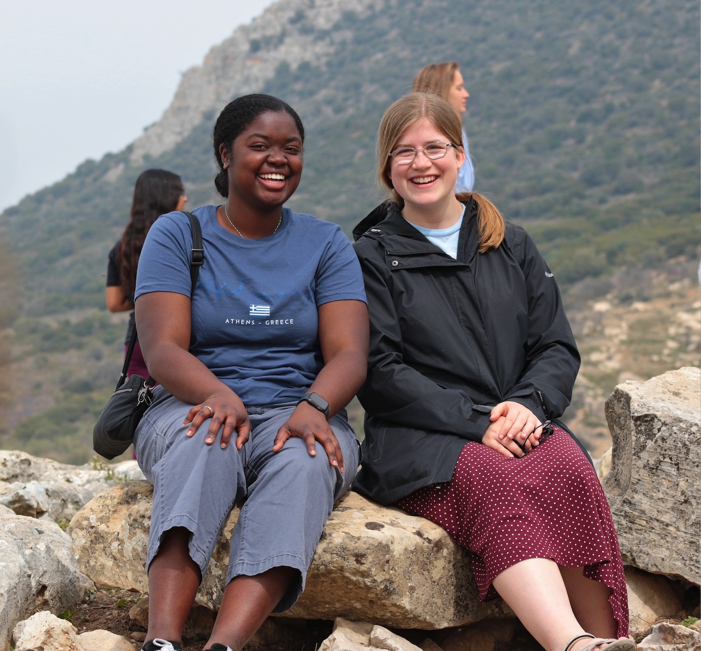 Two female students on hillside in the Mediterranean